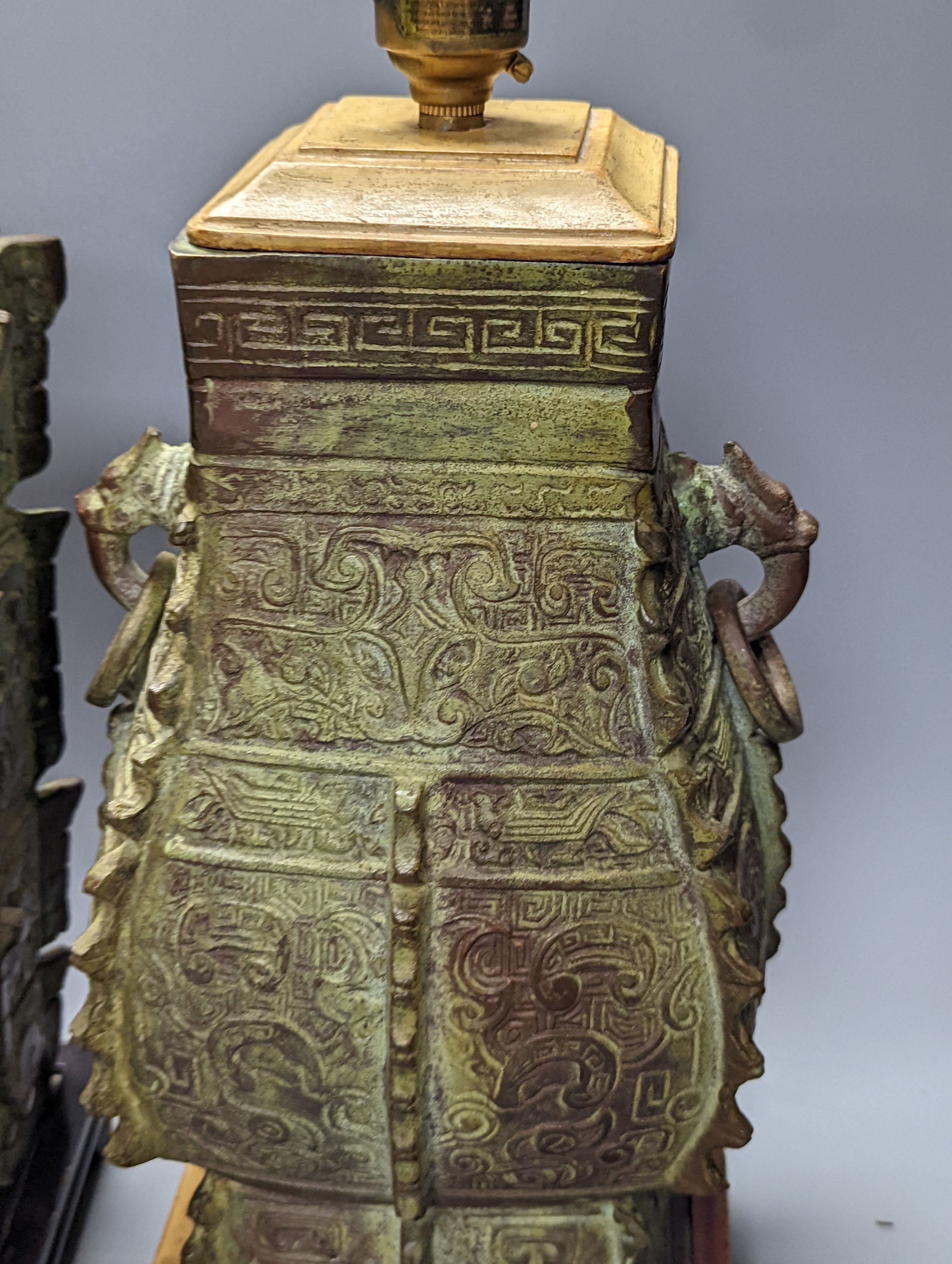 Two Chinese archaic style bronze lamp bases, 38 cm high to top of fitting